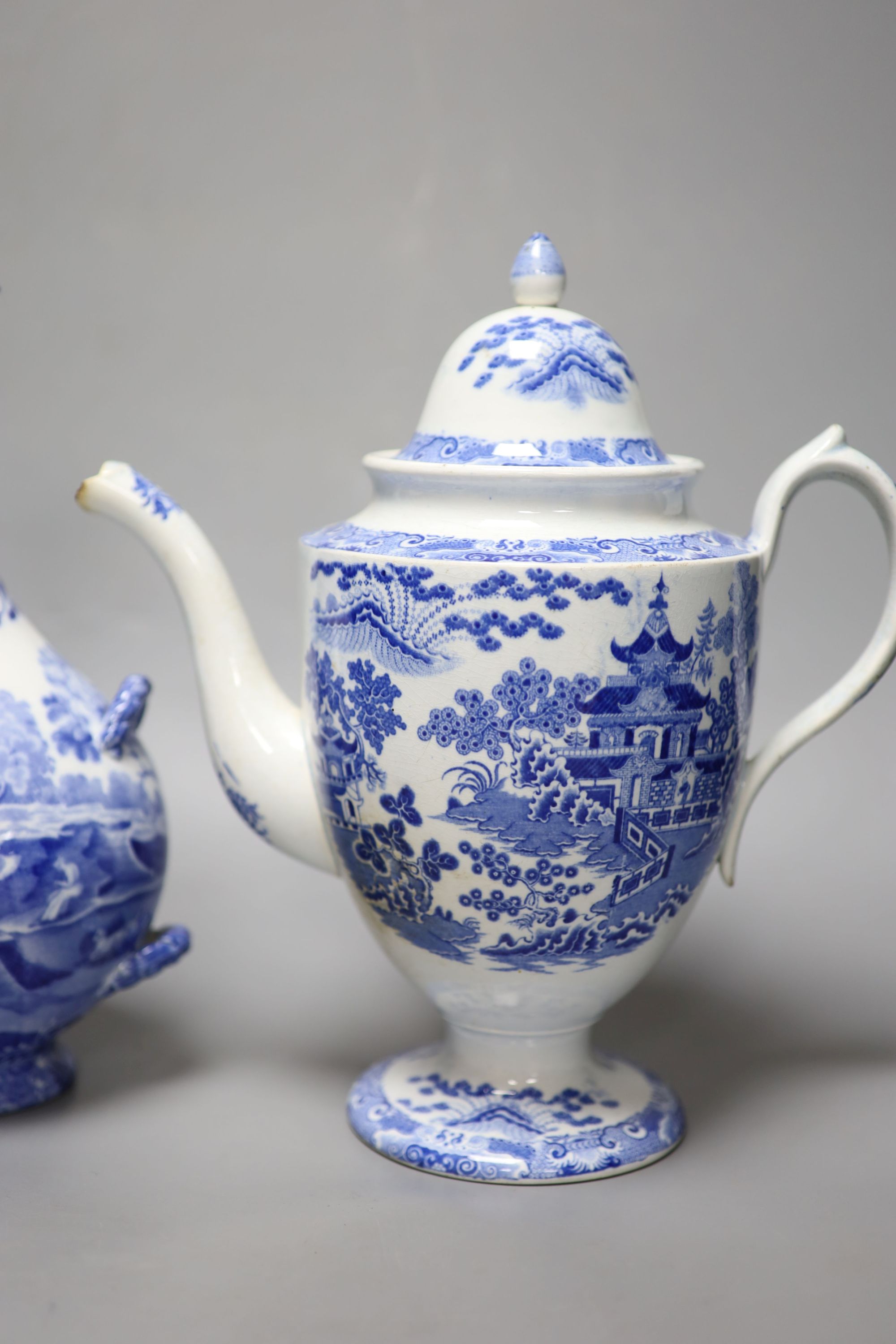 A Staffordshire pearlware blue and white pottery coffee pot and a Copeland Spode pilgrim flask, tallest 31cm